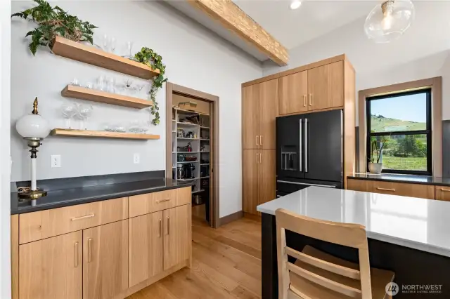 Large walk-in pantry with custom shelving