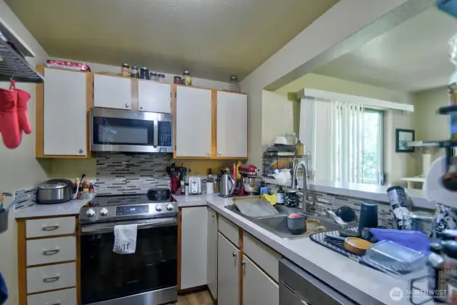 Unit C is also remodeled with new floors, stainless steel appliances and tile backsplash