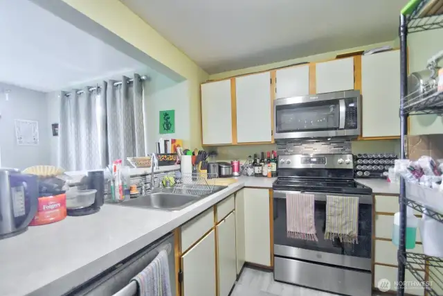 Like Unit C and D, Unit B is also remodeled with new floors, stainless steel appliances and tile back splash.