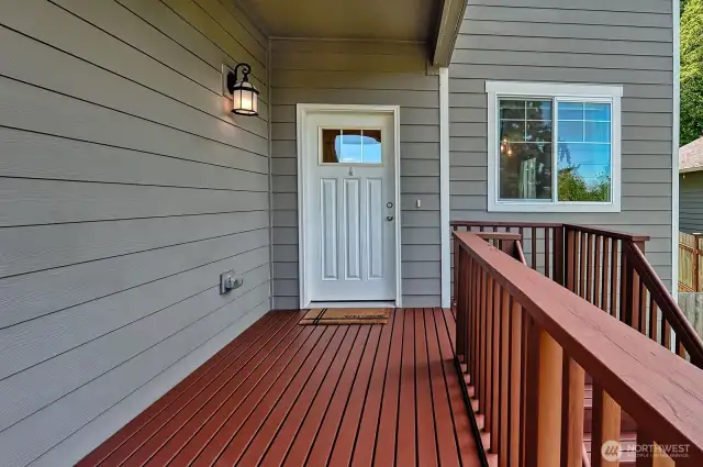 The entry stairs and decking are recently painted.