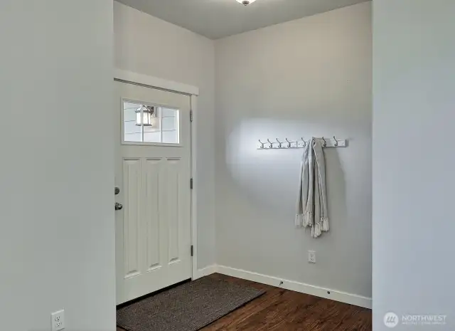 The entry is cozy and tidy and ready to welcome family and friends.