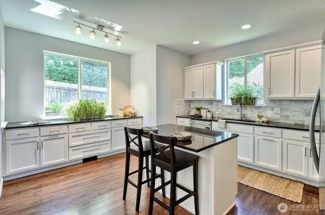 The kitchen has been remodeled and has space for cooking and entertaining.