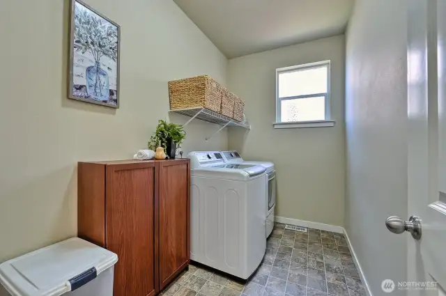 The laundry room is conveniently located on the main floor near the garage entry.
