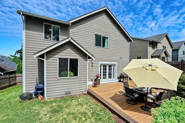 There's plenty of room for all in the fenced backyard. And the deck is easy-care composite.