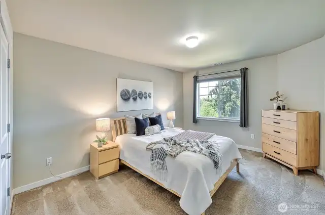 Another bedroom that is serene and restful.