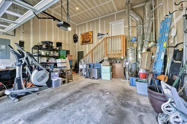The garage is BIG! There's room for cars and a workbench.
