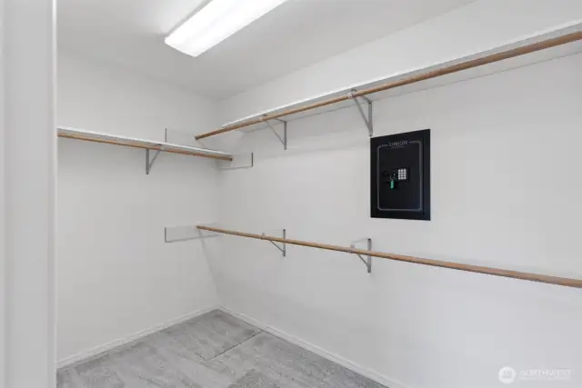 Large primary closet with in wall safe.