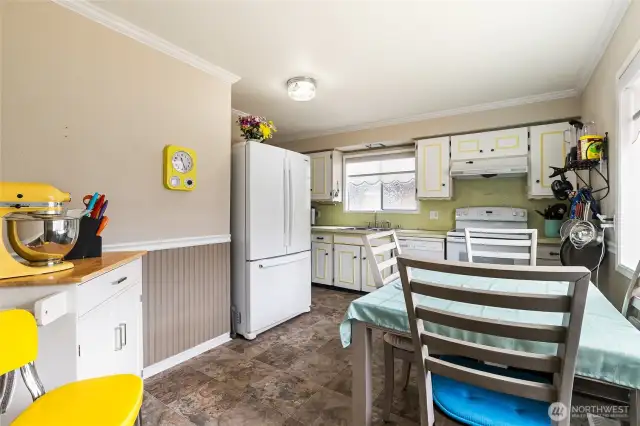Ample storage and counter space in this bright kitchen.