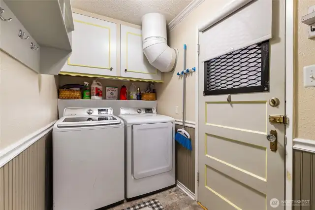 From the kitchen into the laundry area/backdoor entrance.