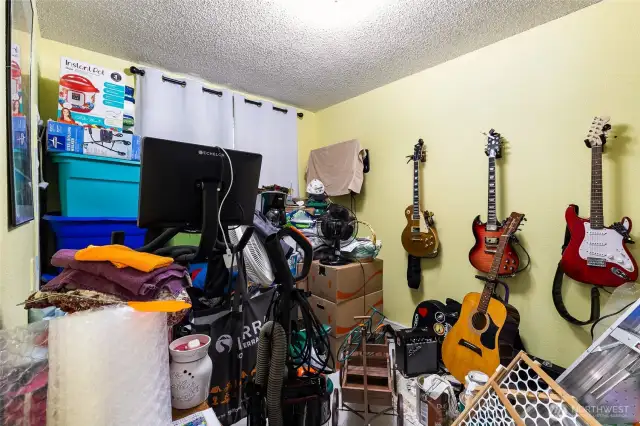 @nd bedroom, currently being used to store boxed up items for moving.