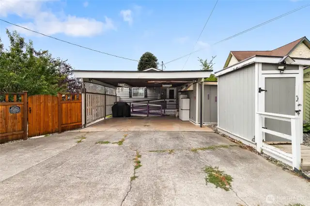 Alley access and your own carport for two cars. As well as 2-sheds for additional storage.