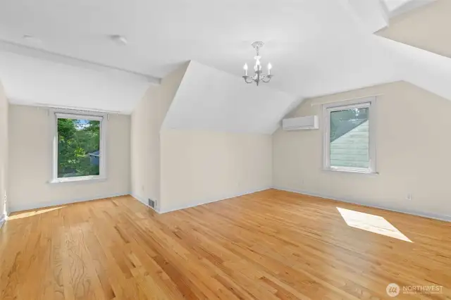 2nd upstairs bedroom with a view and plenty of room for 2 beds and a play room or art room. Vaulted ceilings!