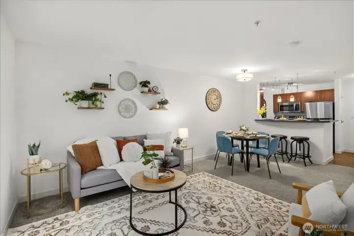 Bright, open concept living area. Stylish white craftsman baseboards.