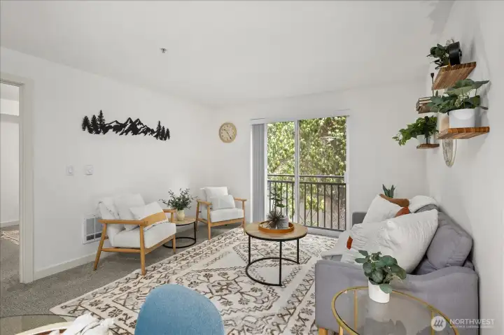 Living area with Juliet balcony overlooking the private gated courtyard.