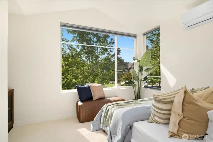 Spacious, light-filled guest bedrooms with vaulted ceilings and another split AC.