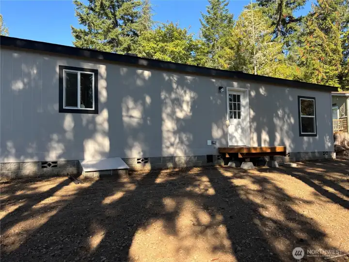 Backyard with nice shade trees.
