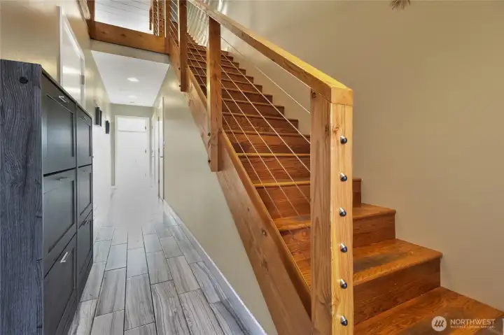 Enter the main level with hallway that leads to a flex room.