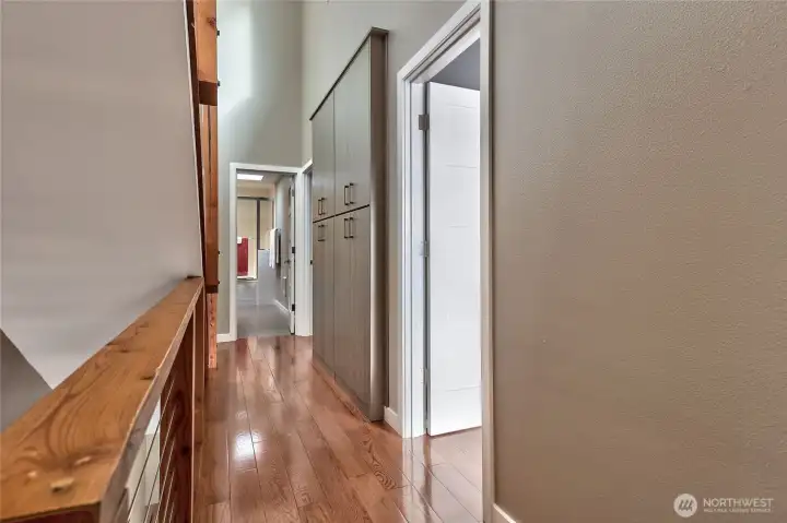 Down the hall from the primary is the laundry center and another guest bedroom and full bath.