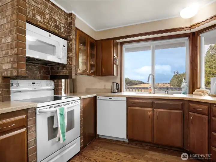 Kitchen with eating space. This room faces the deck which overlooks the dunes and has a full ocean view.