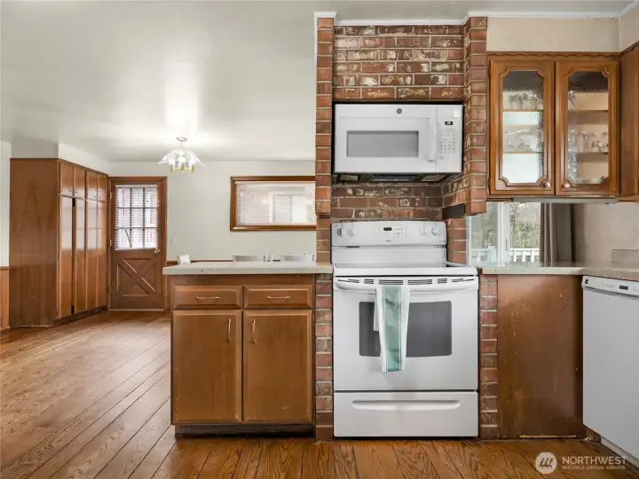 Kitchen with eating space. This room faces the deck which overlooks the dunes and has a full ocean view.