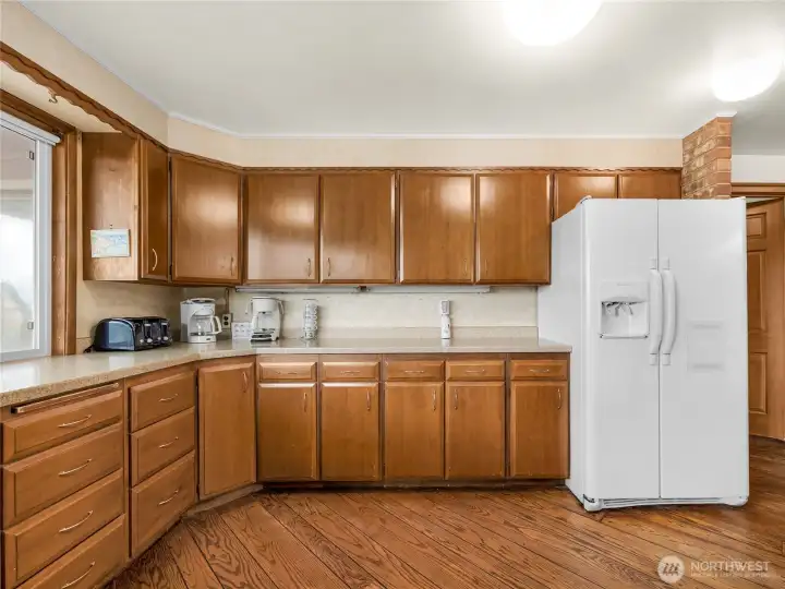 Kitchen with eating space. This room faces the deck which overlooks the dunes and has a full ocean view.