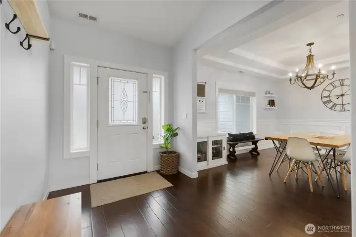 Looking back at the front door and peeking into the dining room.