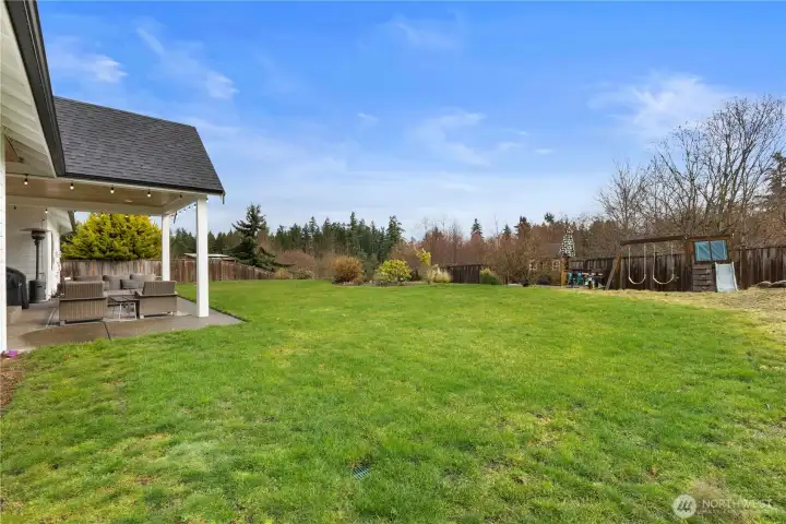 The play house and swing set stay. When the garden is in bloom, it is gorgeous!
