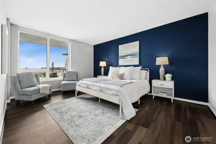 The primary suite is an oasis of calm and beauty, shown here with a king-size bed.