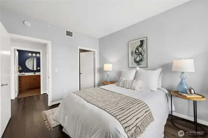 The door near the bed opens to another walk-in closet.