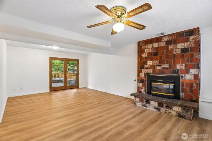 family room on lower level with access to yard
