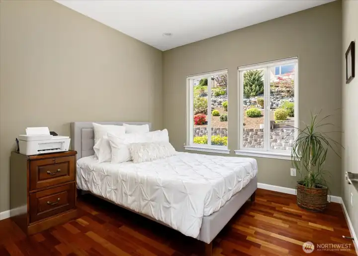 Across the hall from the primary suite, this space can double as either a guest room or prime office.