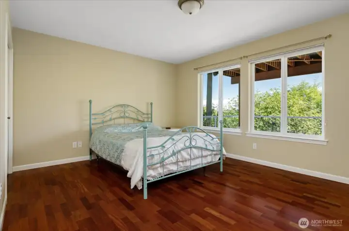 To the left of the living room is a spacious guest suite with two closets.