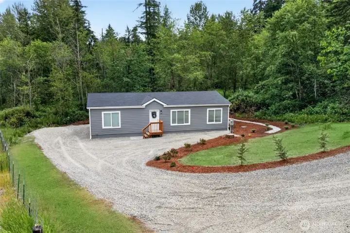 Grass added for photo. Yard is hydroseeded.