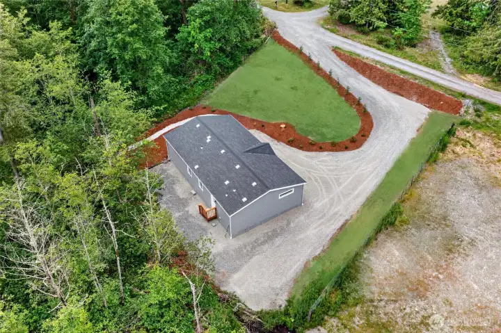 Grass is added virtually.  Yard is hydroseeded.