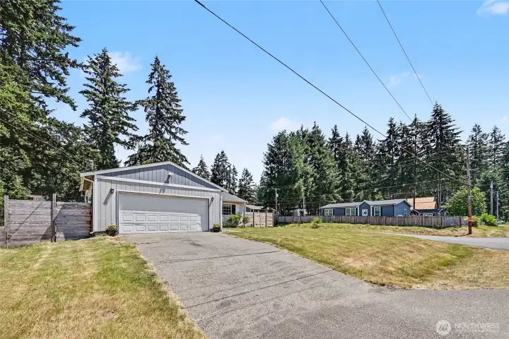 Extended driveway and two-car garage provide ample parking and storage.