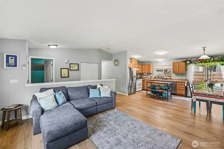 From the moment you enter, you'll appreciate the vaulted ceilings and open-concept design, where the living room, dining area, and kitchen flow seamlessly together.
