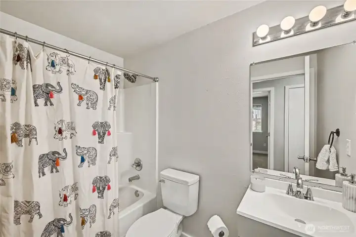 Full size guest bathroom.