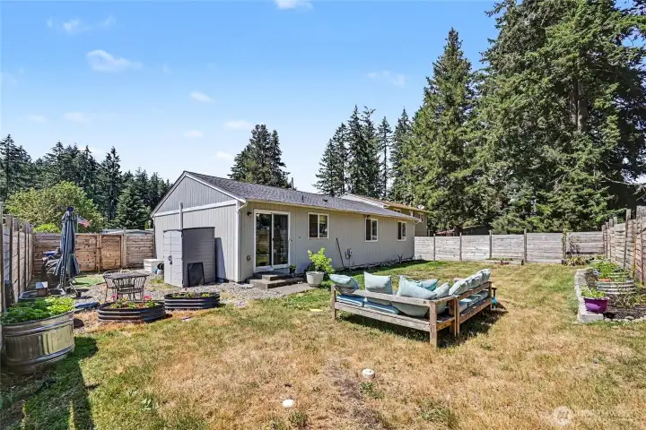 Outside, enjoy a level, fully fenced backyard with plenty of room for play, pets, or gardening.