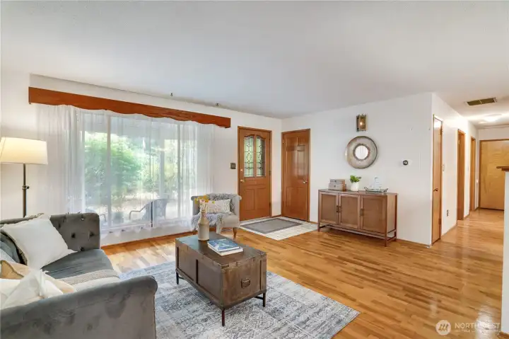 The big front window brings in light and there's a convenient coat closet right inside the front door. The big front window brings in light and there's a convenient coat closet right inside the front door.