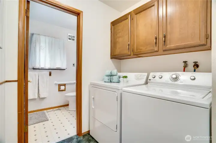 Take the hall past the kitchen to the laundry area that leads into the full bath. Along with updated wiring, this house also has an updated sewer line. Take the hall past the kitchen to the laundry area that leads into the full bath. Along with updated wiring, this house also has an updated sewer line.