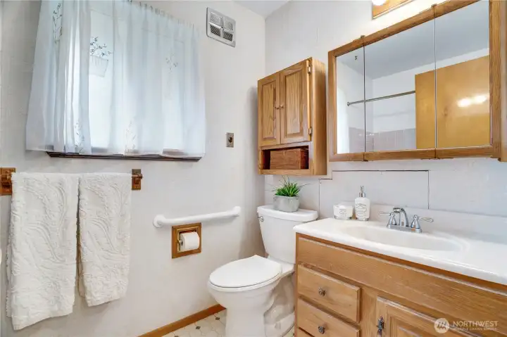 The window opens to the back yard and there's storage in the medicine chests and vanity. The window opens to the back yard and there's storage in the medicine chests and vanity.
