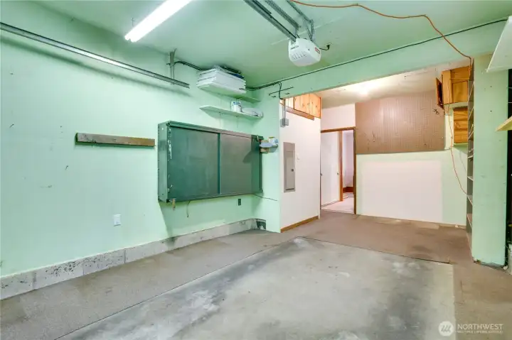 The garage is clean and ready for parking and storage. Notice the 2018 electrical panel on the left. The garage is clean and ready for parking and storage. Notice the 2018 electrical panel on the left.