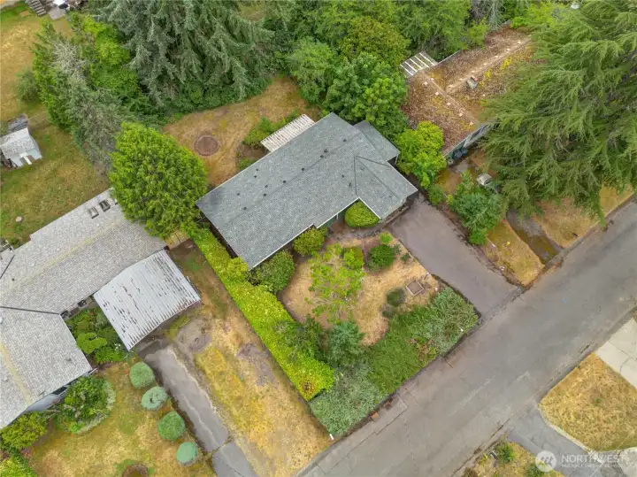 This house is set on a 10,800 sq ft lot with mature trees, shrubs, and hedge for privacy. This house is set on a 10,800 sq ft lot with mature trees, shrubs, and hedge for privacy.