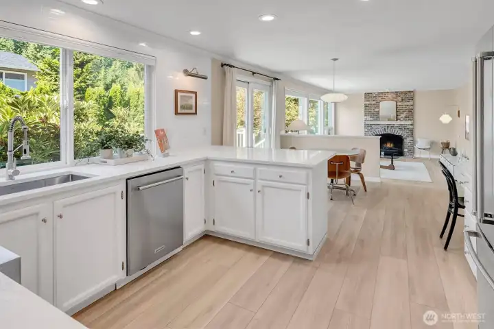 The open-concept layout seamlessly integrates the kitchen with the family room, creating an ideal space for daily life and entertaining.