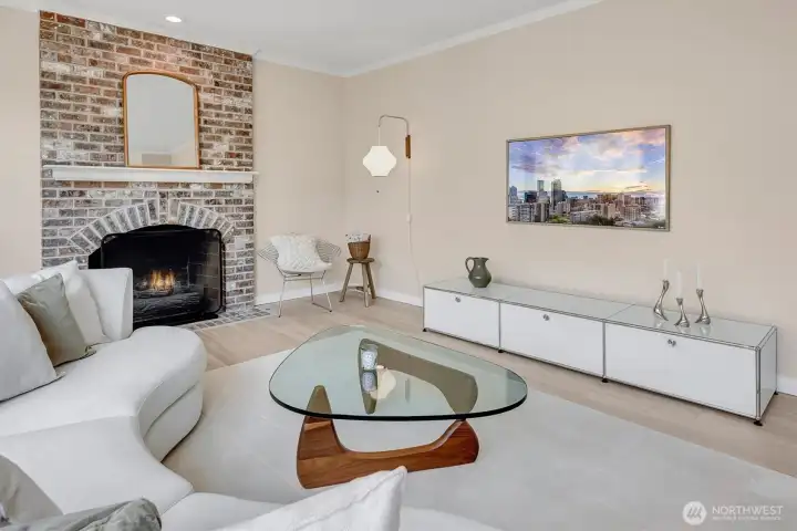 Spacious family room featuring a cozy gas fireplace and wall-mounted television, perfect for relaxation and entertaining.