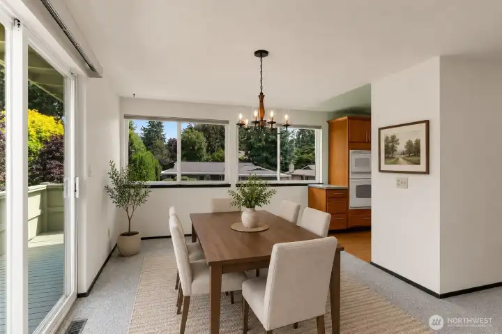 The formal dining room is surrounded by windows allowing in lots of natural light. *Virtually staged* The formal dining room is surrounded by windows allowing in lots of natural light. *Virtually staged*