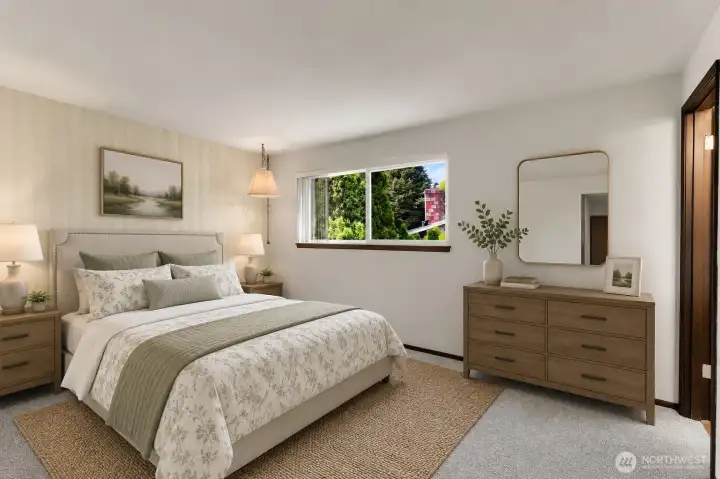 The primary bedroom with attached 3/4 bath. *Virtually staged* The primary bedroom with attached 3/4 bath. *Virtually staged*