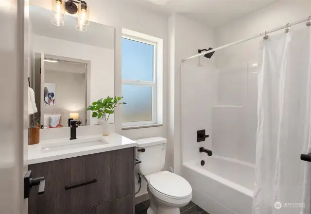 Main floor En Suite with attached full bath and exterior entrance.  Only available in the A and B buildings.  Photo is of the Model Home unit A-1