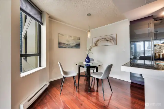 Dining area off the kitchen & separate from the living room yet open for style.