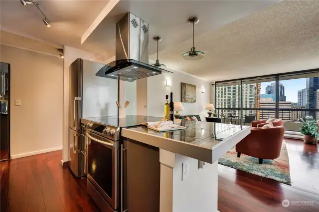 Check out the kitchen that was opened up with the extended countertop/bar to sit with a laptop or eat casually.